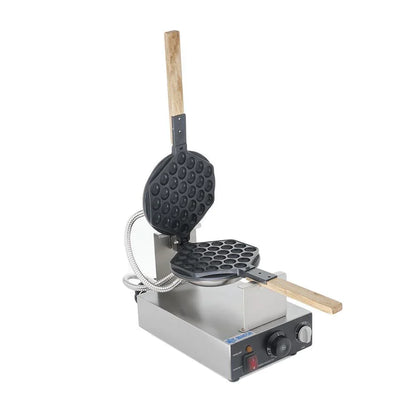 Wafflera de Burbuja Giratoria MIGSA HK-Q1 en acero inoxidable, con planchas de hierro fundido recubiertas de Teflón antiadherente. Sistema eléctrico giratorio, termostato ajustable, reloj temporizador de 5 minutos y foco piloto. Voltaje: 120V (clavija no incluida). Medidas: 31.4x30x20 cm, peso 3.7 kg
